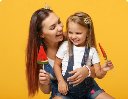 mother and daughter eating popsicle talking about the gut brain axes and how important it is to child brain development